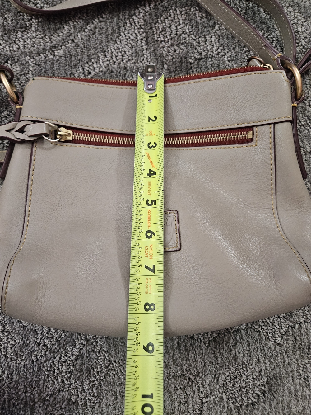 Dooney & Bourke Florentine Allison Crossbody bag is featured in a light taupe - Picture 4 of 6